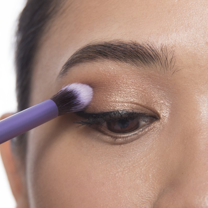 Adding dark shadows to the corner of the eyelid