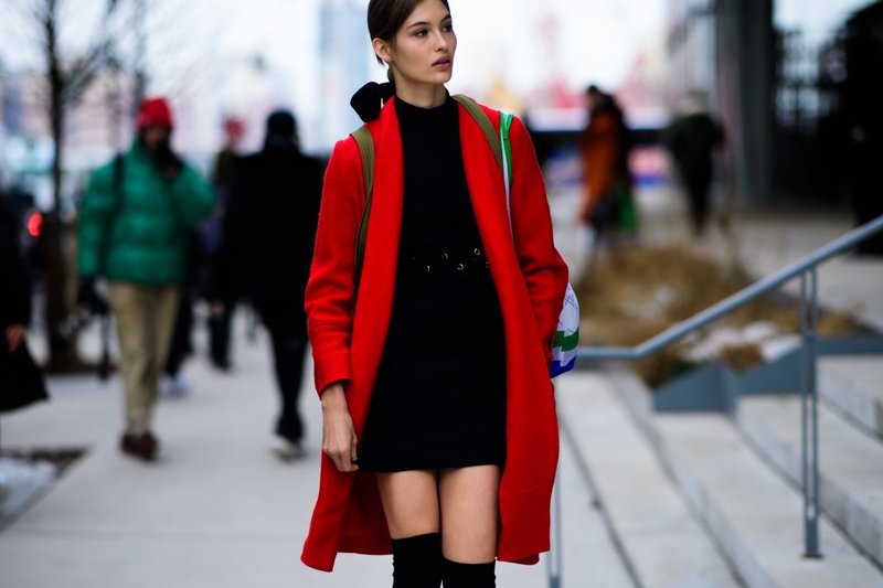 Black dress with a red coat