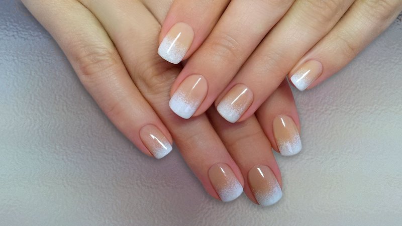 Light gradient in french manicure with gel polish