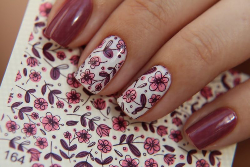 Gentle manicure with stickers.