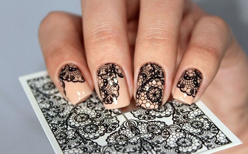 Peach manicure with lace.