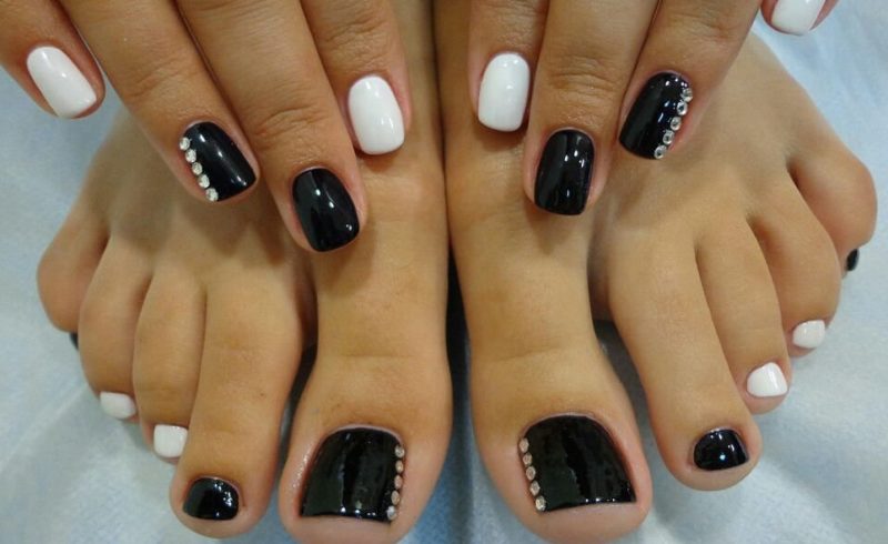 Black and white pedicure with rhinestones