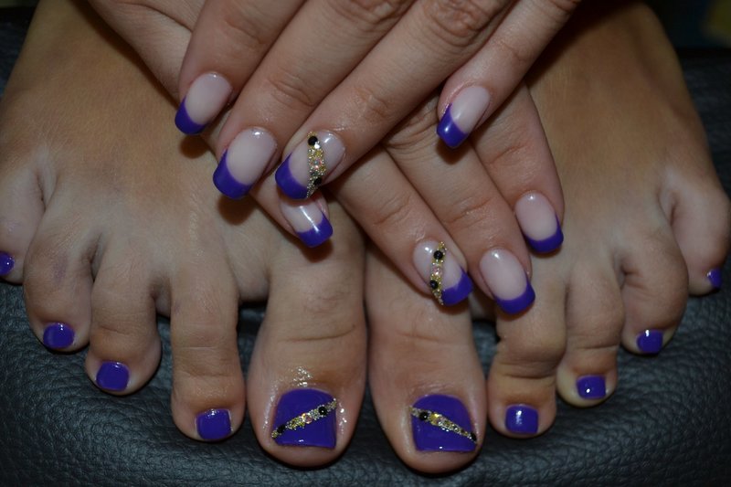 Purple nails with black rhinestones