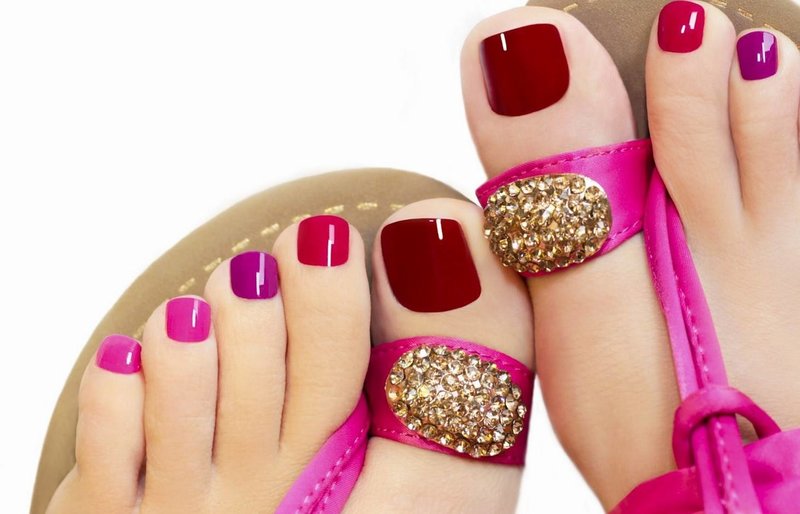 Red pedicure with a combination of pink