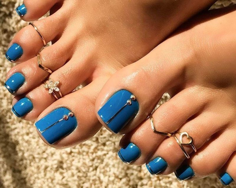 Blue pedicure with rhinestones