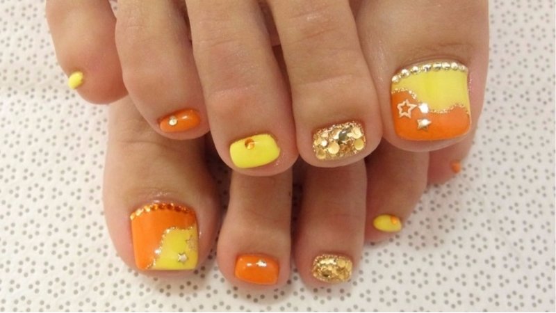 Yellow orange pedicure