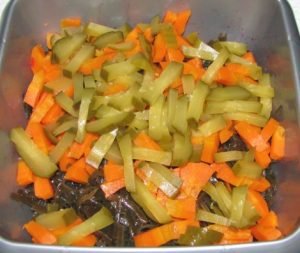 Vegetable salad with seaweed and crab sticks