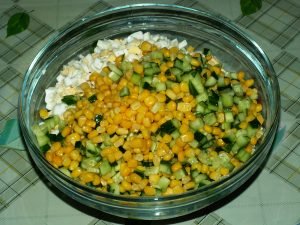 Salad with crab sticks, corn and fresh cucumber