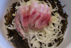 Salad of seaweed, pickled herring and onions