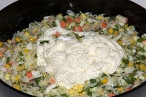 Salad with crab sticks and rice