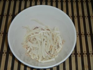 Salad with squid, crab sticks and red caviar