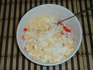 Salad with squid, crab sticks and red caviar