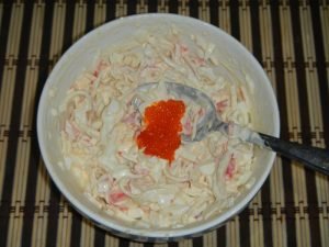 Salad with squid, crab sticks and red caviar