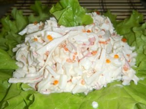 Salad with squid, crab sticks and red caviar