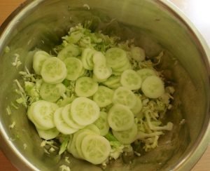 Young cabbage salad with cucumbers