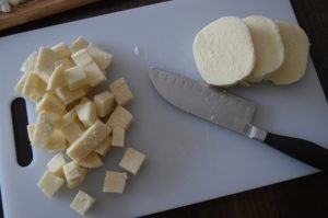 Salad with smoked sausage, cheese and arugula