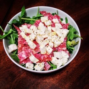 Salad with smoked sausage, cheese and arugula