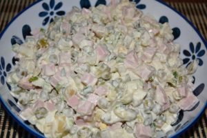 Classic Olivier salad with sausage and pickles