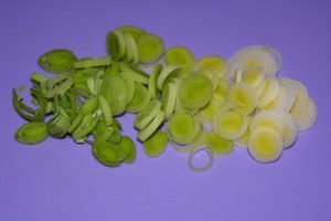 Fresh cucumber and tomato salad with egg and leek