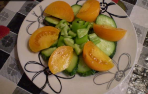 Vegetable salad with yellow tomatoes