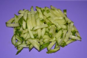 Fresh cucumber and tomato salad with egg and leek