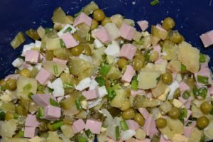 Classic Olivier salad with sausage and pickles