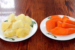 Mimosa salad with saury and potatoes