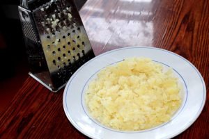 Mimosa salad with saury and potatoes