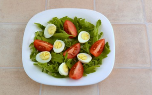 Arugula, tomato, quail egg and trout salad