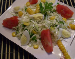 Vegetable salad with corn and quail eggs