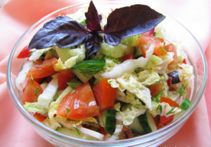 Salad with radish, Beijing cabbage, cucumber and tomato