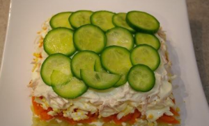 Delicious salad with chicken, fresh cucumber and corn