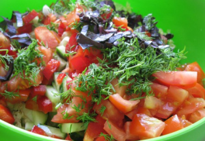 Salad with radish, Beijing cabbage, cucumber and tomato