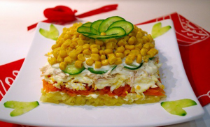 Delicious salad with chicken, fresh cucumber and corn