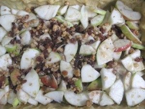 Open apple pie with raisins and walnuts