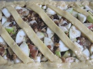 Open apple pie with raisins and walnuts