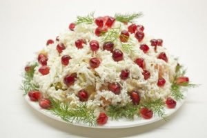 Holiday salad with chicken, feta cheese and hollandaise sauce