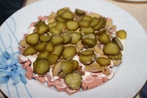 Salad with boiled sausage and green peas