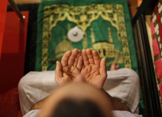 Muslim man reads the surah before going to bed