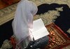 Muslim woman praying for house cleansing