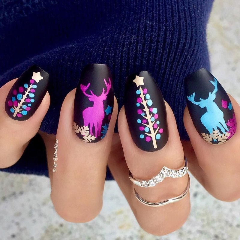 Black manicure with New Year prints.