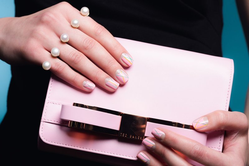 Nude manicure with colored stripes on short nails.