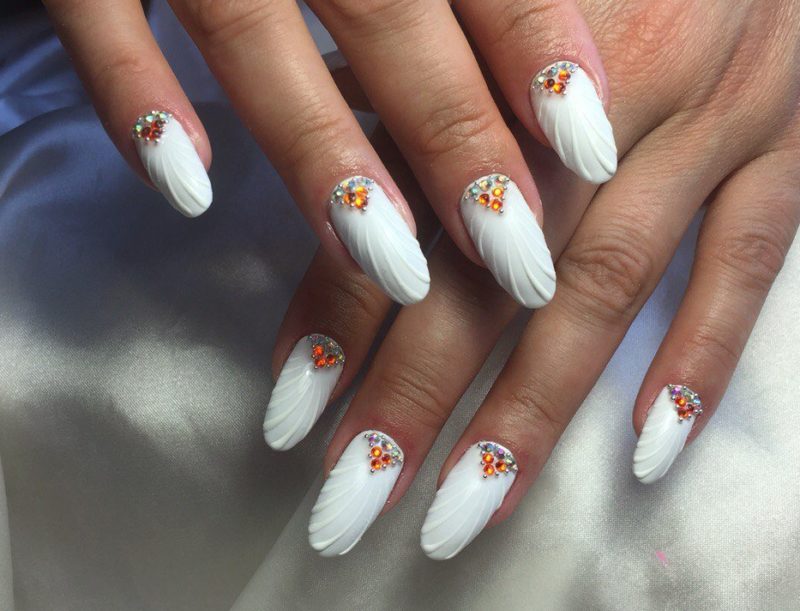 Wedding manicure seashell with orange rhinestones