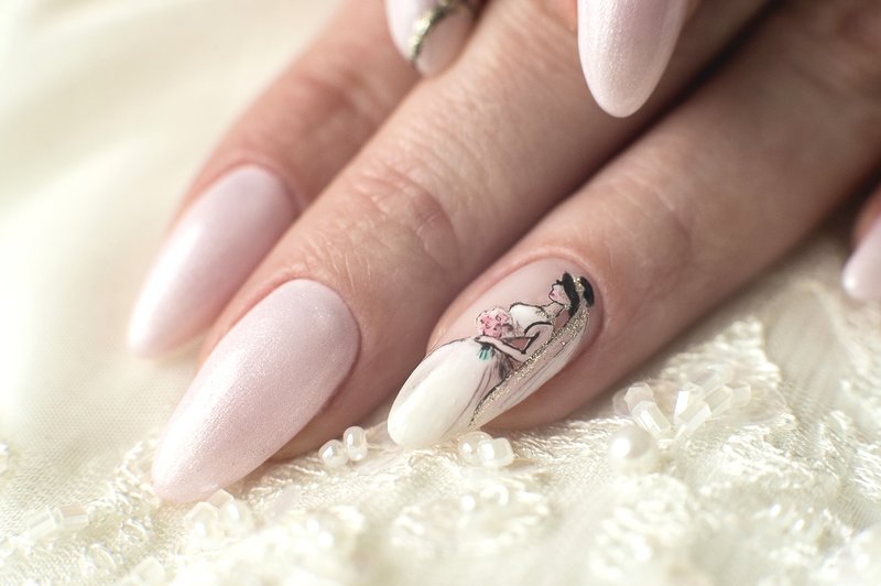 Wedding pale pink manicure with a drawing of the bride