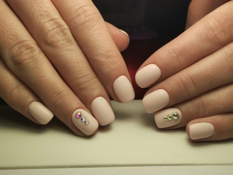 Beige matte nails with rhinestones