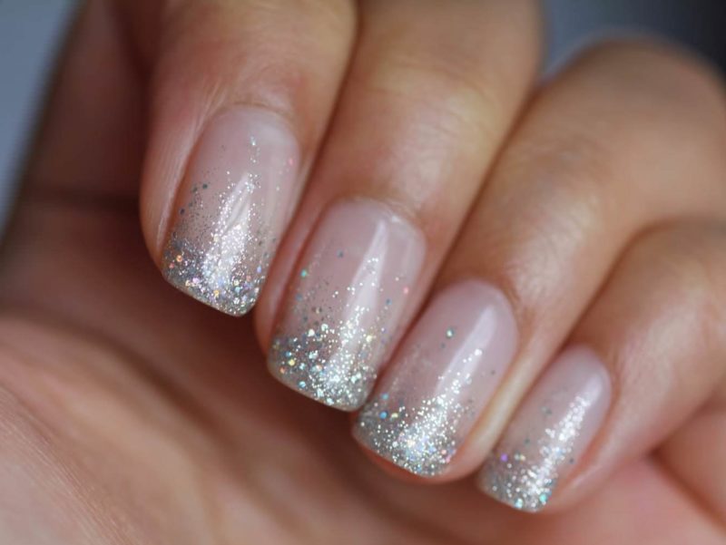 Nude manicure with silver glitter