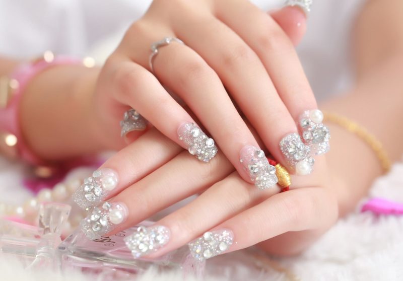 Wedding manicure with sequins and rhinestones