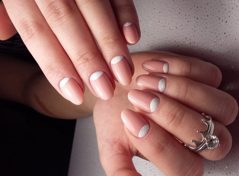 Delicate nude manicure with holes