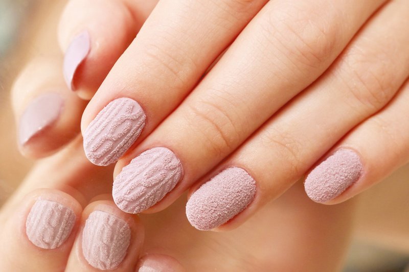 Matte pale pink manicure with powder and volumetric pattern