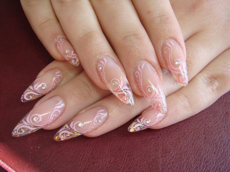 Glass manicure with a nude base and floral motif